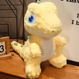 PELUCHE DINOSAURE: peluche dino grand yeux