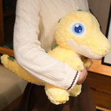 PELUCHE DINOSAURE: peluche dino grand yeux